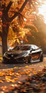 Trong hầm gửi xe, Honda Civic Type R đỏ rực nằm thấp, mâm đen nổi bật dưới đèn.
