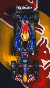 Góc nhìn thẳng từ trên cao cho thấy xe Red Bull nằm gọn giữa nền đỏ vàng nổi bật.