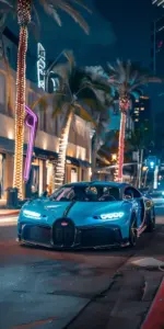 Chiếc Lamborghini màu vàng đậu cạnh Bugatti trong gara, tạo khung hình siêu xe đầy nổi bật.