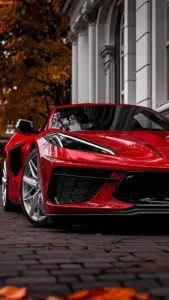 Một chiếc Ferrari đỏ trong ảnh khóa màn hình Ferrari đậu cạnh vỉa hè, cửa kính phản chiếu hàng cây.