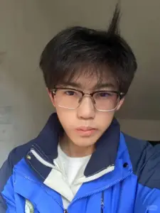 Áo khoác xanh dương và kính gọng đen tạo vẻ nghiêm túc trong ảnh selfie